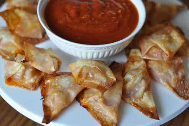 pizza won tons pizza won tons and sauce on a plate