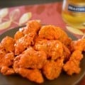 plate of boneless chicken bites with buffalo sauce